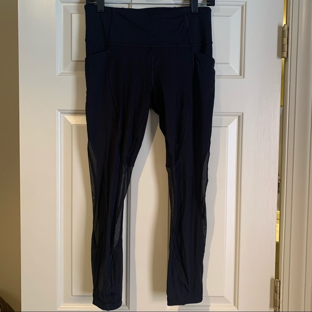 Lululemon black tight with mesh cutouts, size 8